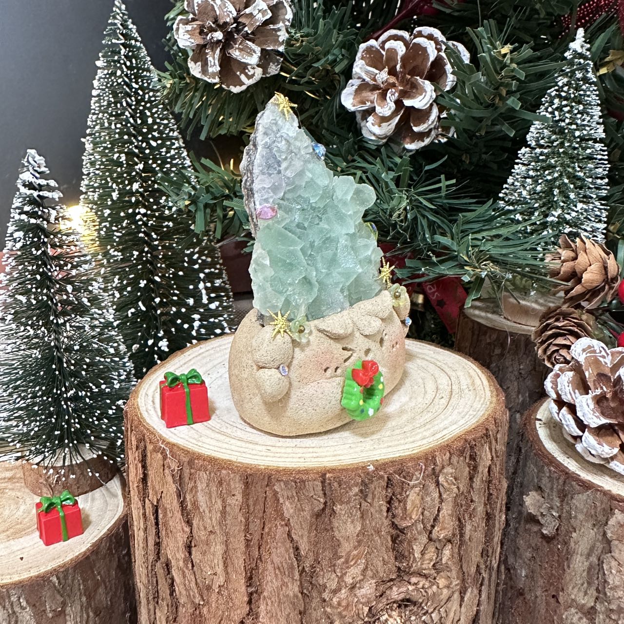 Christmas doll with green transparent crystal