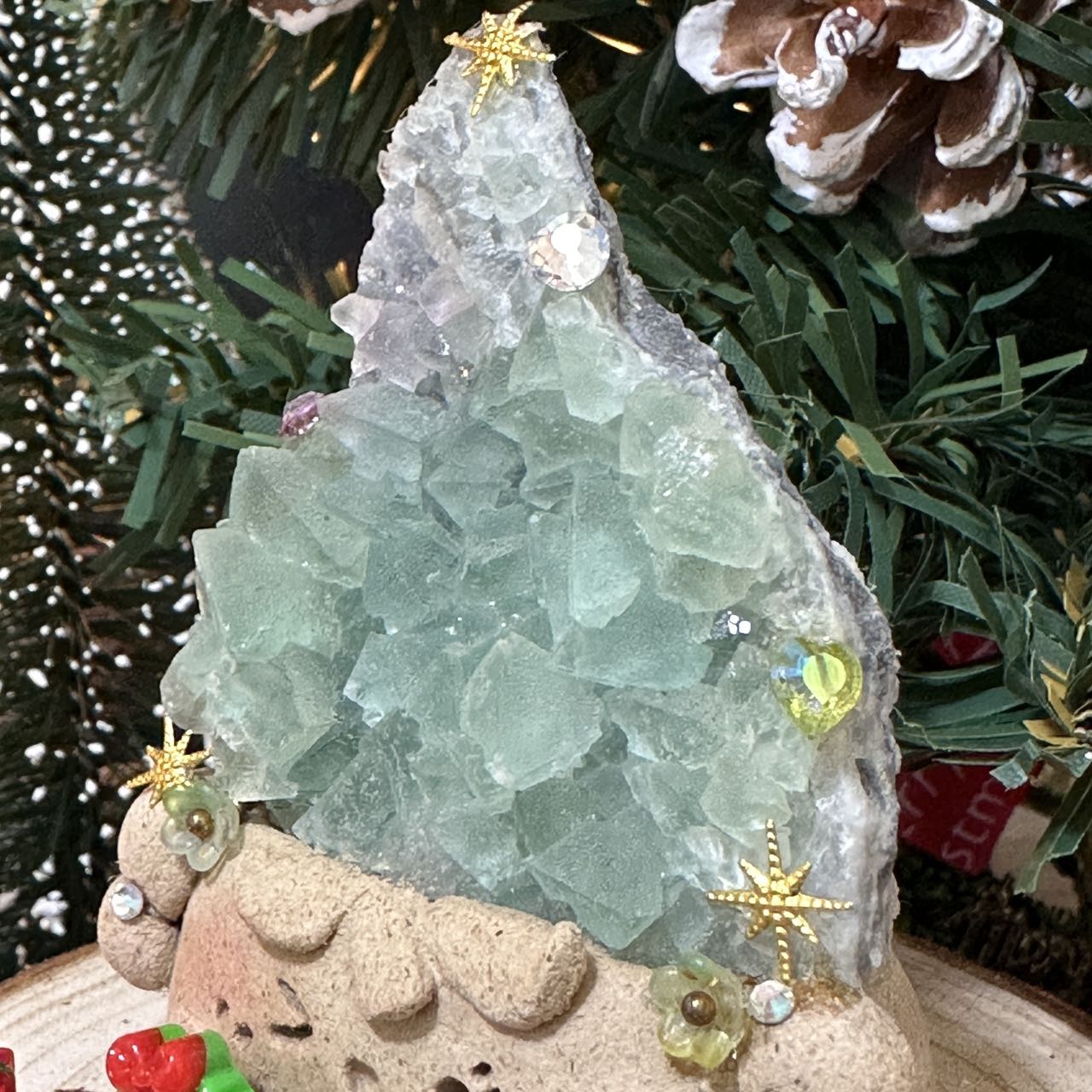 Christmas doll with green transparent crystal