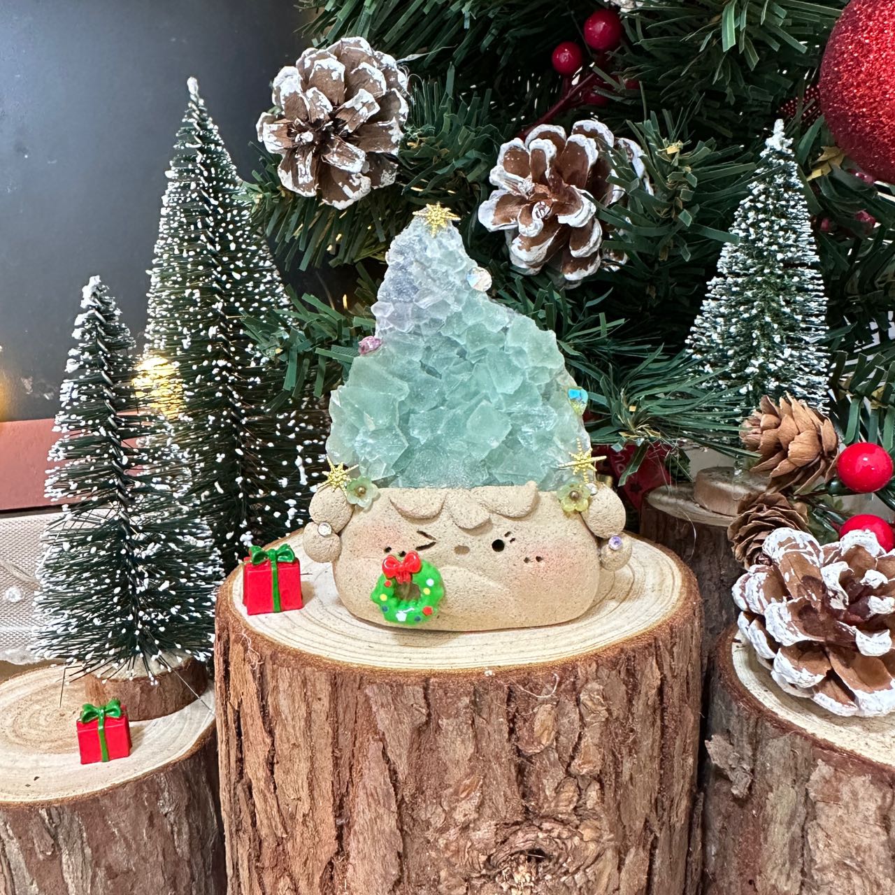 Christmas doll with green transparent crystal