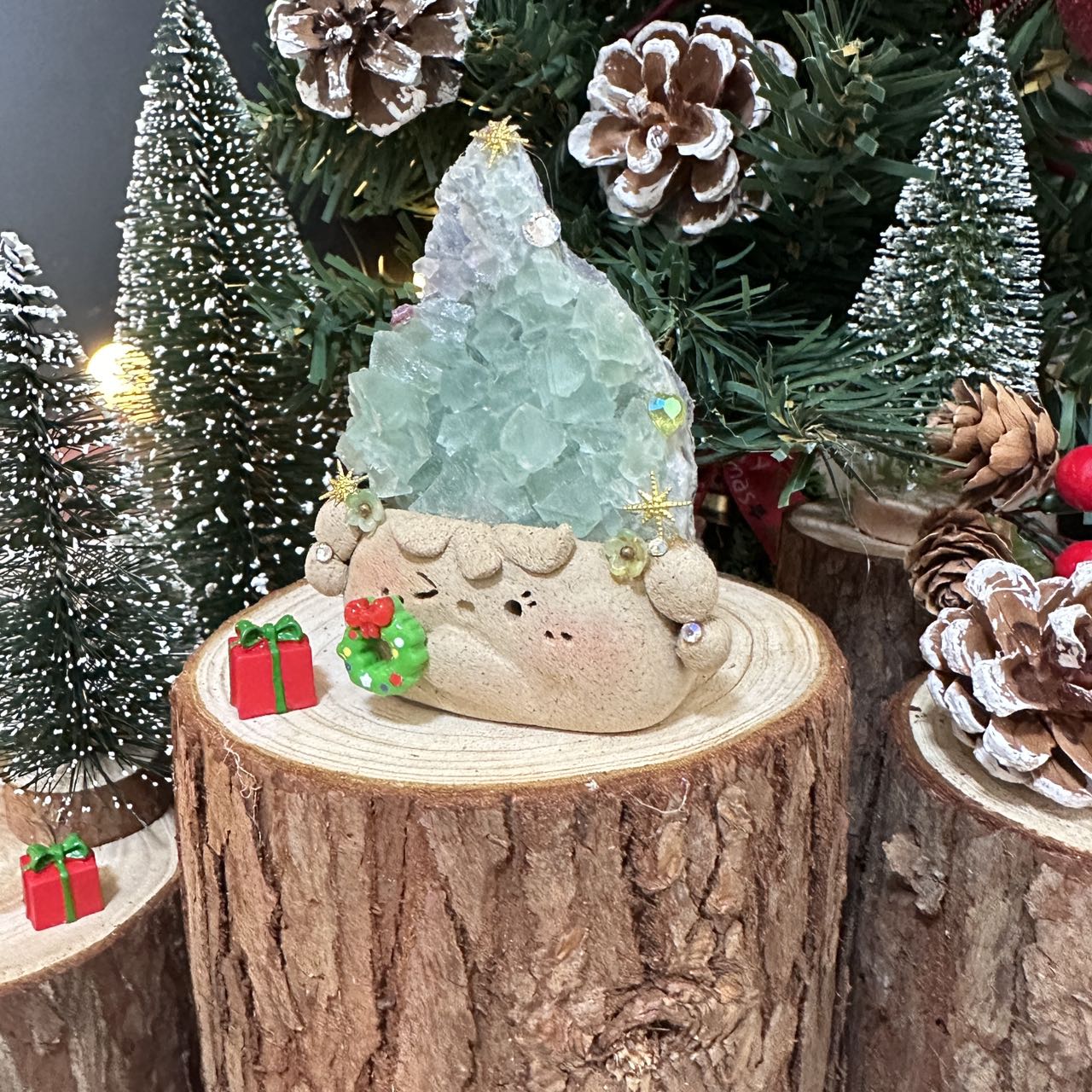 Christmas doll with green transparent crystal